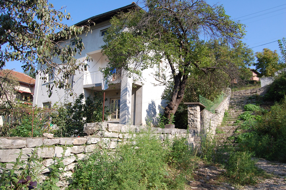 /solid-country-house-located-in-a-picturesque-village-near-river-and-mountains/